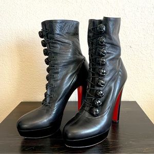 Black Christian Louboutin heeled boots.